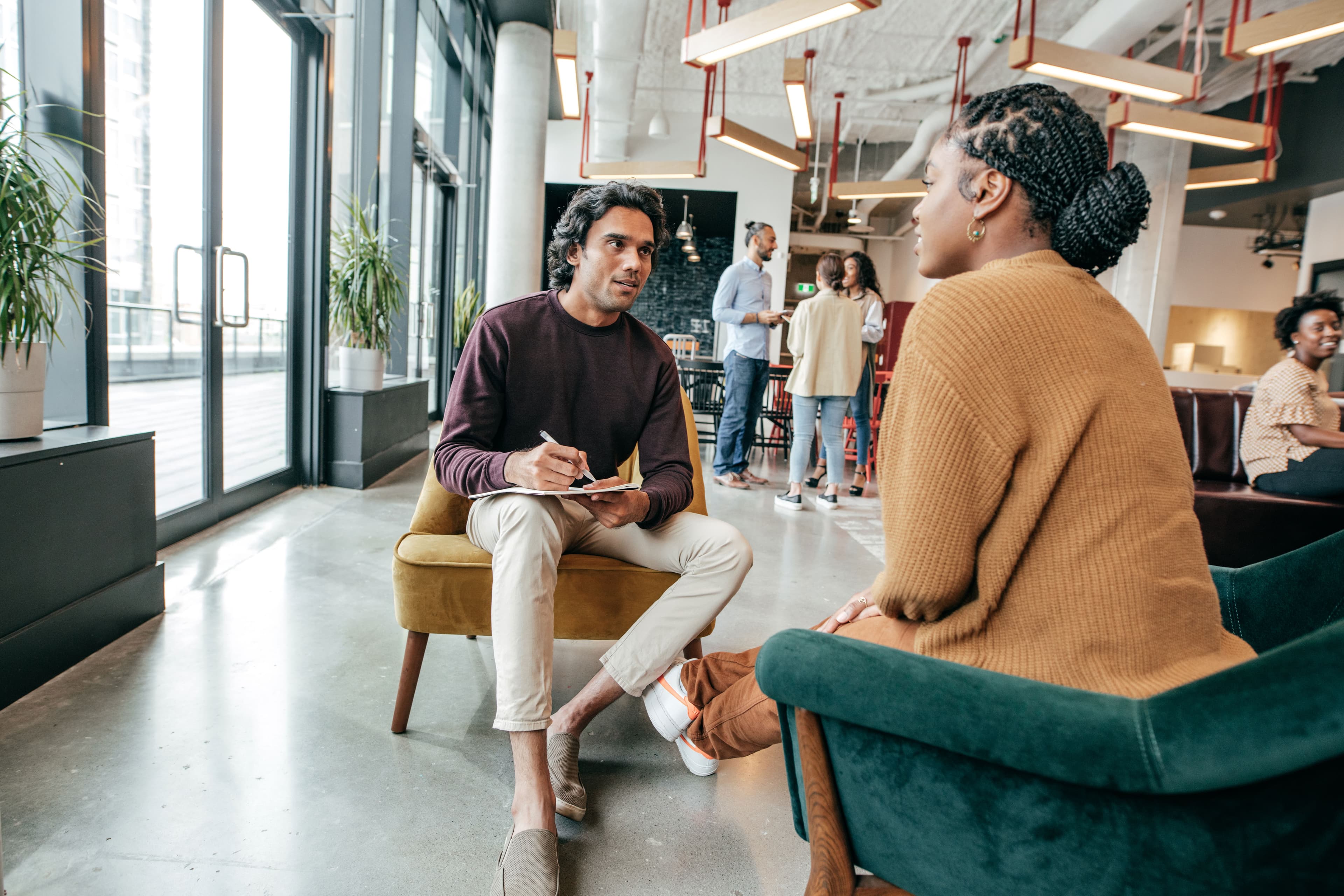 Two professionals in a bright office representing MBA interview preparation